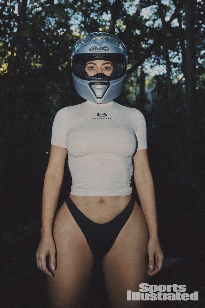 Kim Kardashian was photographed by Greg Swales in the Dominican Republic. Swimsuit by SKIMS. Top by Balenciaga. Helmet by HJC.
